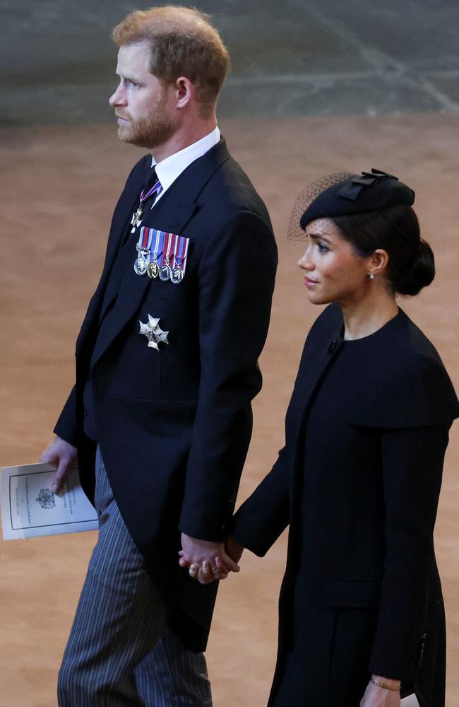 The couple held hands as they walked in the procession. Picture: Getty Images