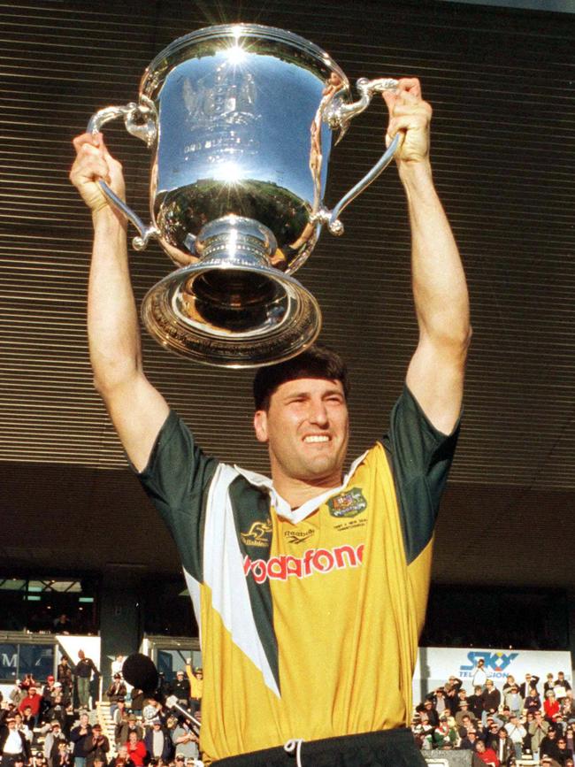 John Eales lifts the Bledisloe Cup in 1998 in a much-maligned jersey design