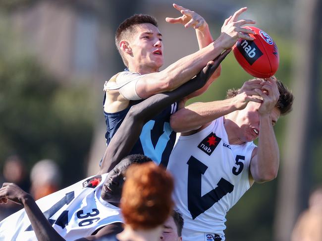 Ben De Bolfo crashes the pack for Vic Metro. Pic: Michael Klein