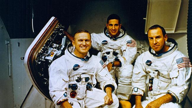 The Apollo 8 crew (from left) commander Frank Borman, lunar module pilot William Anders, and command module pilot James Lovell pose in front of the Apollo mission simulator in 1968. Picture: NASA / AFP