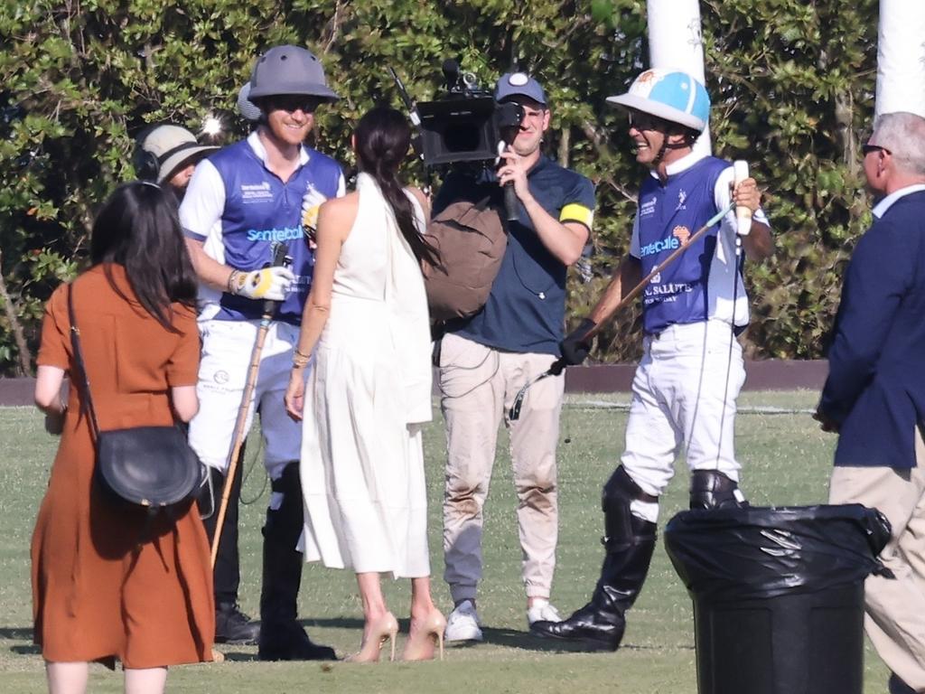 Prince Harry and Meghan Markle being followed by a camera crew for his new Netflix documenrat on polo. Picture: MiamiPIXX/Vaem