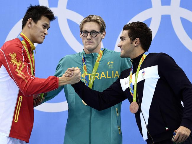 Australia's Mack Horton poses with silver medallist Sun Yang and bronze medallist Gabriele Detti after he won the Men's 400m Freestyle Final during the swimming event at the Rio 2016 Olympic Games. Picture: Martin Bureau