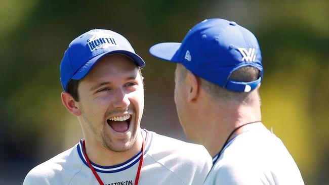 Jackson Kornberg sharing a laugh at North Melbourne AFLW training.