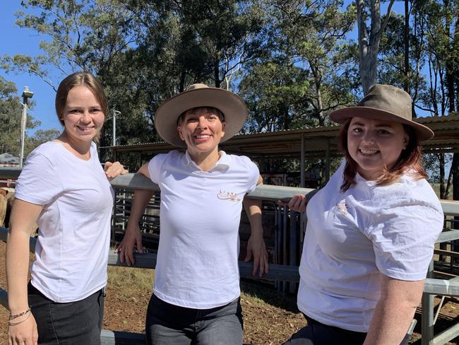 (L-R) Farm foster mum Kirra Smith, Til The Cows Come Home farm animal charity founder and CEO Donna Wild, and rescue team coordinator Phoebe Wisken with the 27 head of cattle bound for their forever home.