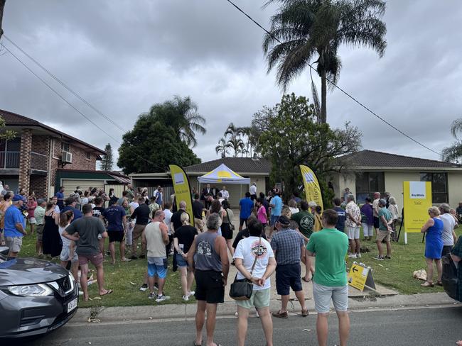 A crowd of more than 150 people turned up to the auction at 23 Robert Stanley Drive, Mount Warren Park