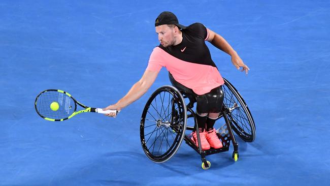 Dylan Alcott of Australia in action against Heath Davidson of Australia in round three of the mens quad singles during day twelve of the Australian Open tennis tournament, in Melbourne, Friday, January 26, 2018. (AAP Image/Julian Smith) NO ARCHIVING, EDITORIAL USE ONLY