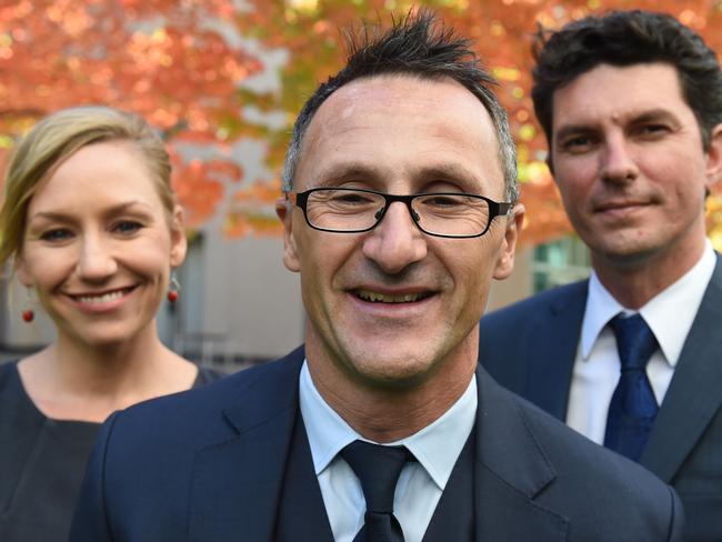 Australian Greens senator Scott Ludlam (right) with Greens Leader Richard Di Natale (centre) and Senator Larissa Waters (left). Questions linger as to how many Greens members continue to hold dual citizenship, making him ineligible for parliament. Picture: AAP