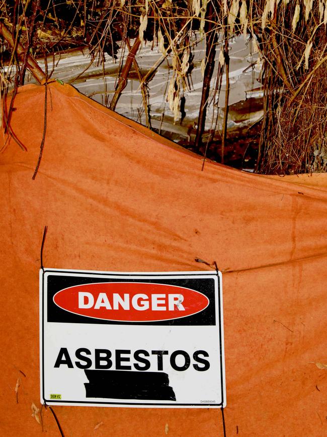 Asbestos loosely covered by a sheet along A’Becketts creek in Granville last month. 