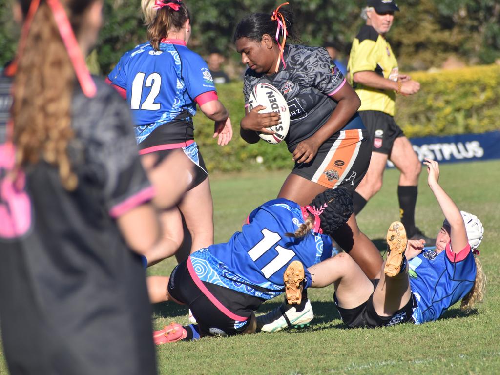 Rockhampton Tigers' prop Vivian Mosby charges into the Norths' defensive line in the under-17 girls grand final. Photo: Pam McKay