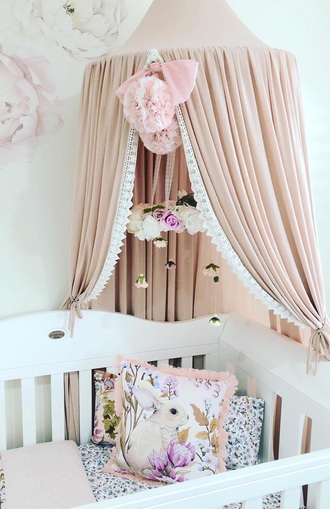 Bonnie has a gorgeous nursery nook with a white bassinet and feeding chair.