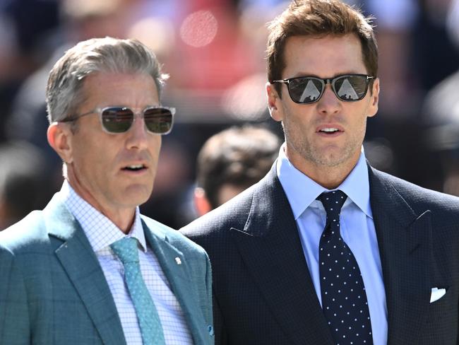 CLEVELAND, OHIO - SEPTEMBER 08: Broadcasters Kevin Burkhardt (L) and Tom Brady (R) walk along the field before the game between the Dallas Cowboys and Cleveland Browns at Cleveland Browns Stadium on September 08, 2024 in Cleveland, Ohio. (Photo by Nick Cammett/Getty Images)