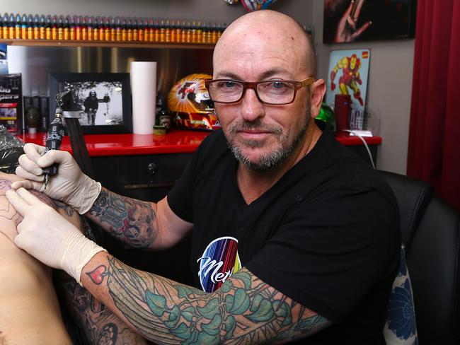 Method Tattoo owner Craig Goss is rallying for the State Government to abolish proposed laws that could reduce the ink available to Queensland artists, Graig is pictured working on client Shaun Bennett from North Lakes, Brendale Tuesday 11th May 2021 Picture David Clark