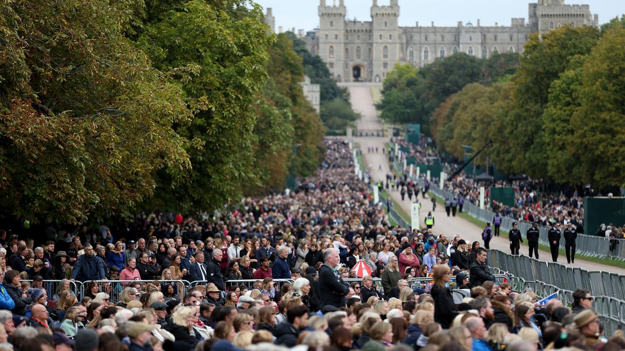 Windsor, UK: Members of the public watch the State funeral of Queen Elizabeth II on big screens on the Long walk on September 19 in Windsor, England. Picture: Getty Images