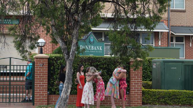 Mourners hug as they arrive at the service. Picture: NCA NewsWire / Flavio Brancaleone