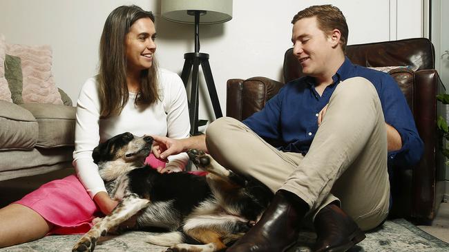 FOR AT HOME LIFTOUT. El Leverington and Freddie Evans with their dog Gemma in their Apartment. Picture: John Appleyard