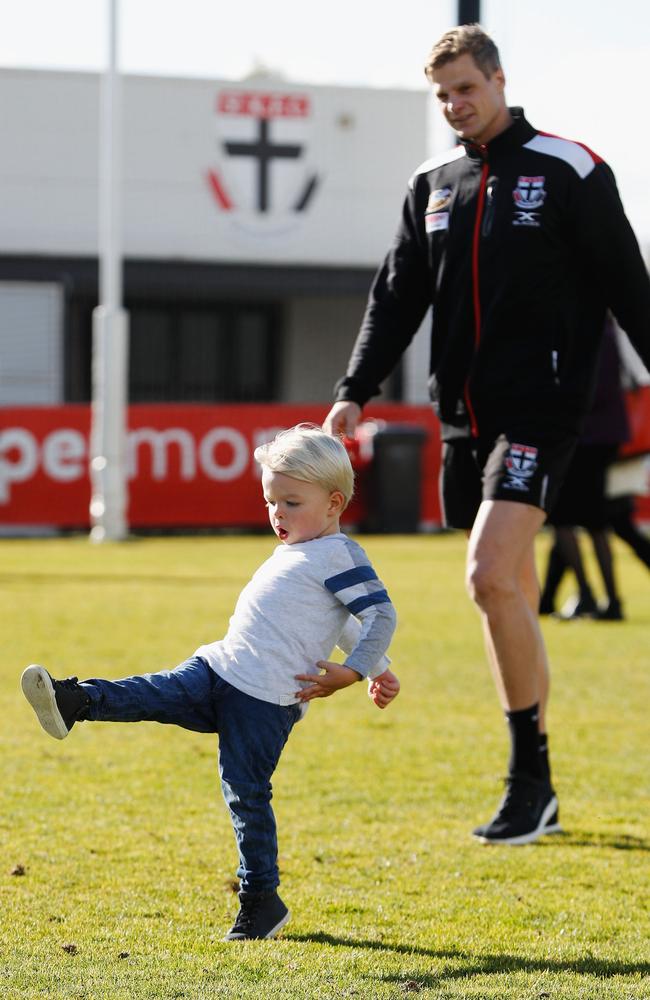 Nick Riewoldt watches son James kick the football after he announced his retirement.