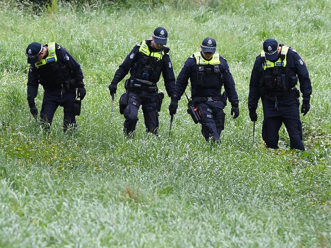 Police conduct a line search at Dandenong Creek in Bayswater after Mr Virgona was shot and killed on the EastLink Freeway. Picture: Julian Smith/AAP