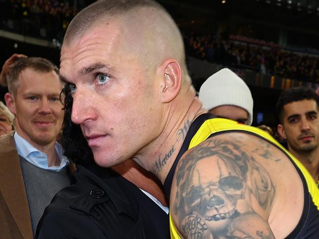 MELBOURNE, AUSTRALIA - JUNE 15: Dustin Martin of the Tigers embraces his agent Ralph Carr following his 300th match the round 14 AFL match between Richmond Tigers and Hawthorn Hawks at Melbourne Cricket Ground on June 15, 2024 in Melbourne, Australia. (Photo by Graham Denholm/Getty Images)