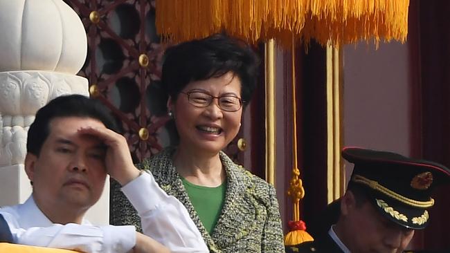 Hong Kong Chief Executive Carrie Lam attends a military parade in Tiananmen Square in Beijing on October 1, 2019, to mark the 70th anniversary of the founding of the People's Republic of China. (Photo by GREG BAKER / AFP)