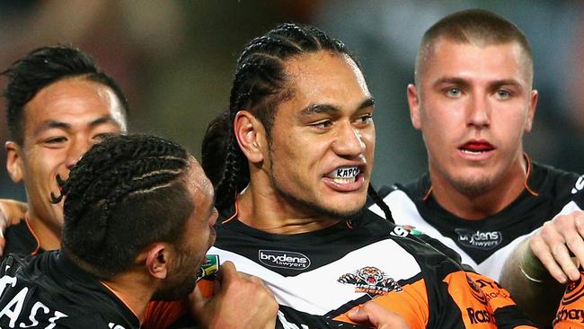 SYDNEY, AUSTRALIA - JUNE 12: Martin Taupau of the Tigers celebrates scoring a try during the round 14 NRL match between the Wests Tigers and the South Sydney Rabbitohs at ANZ Stadium on June 12, 2015 in Sydney, Australia. (Photo by Cameron Spencer/Getty Images)