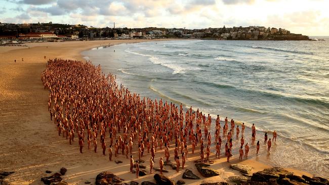 Members of the public pose at Bondi Beach for US artist and photographer Spencer Tunick. Photo: Don Arnold.