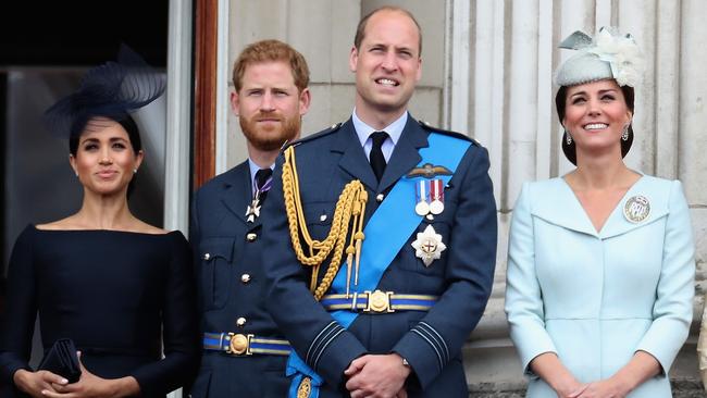 Meghan, Harry, William and Catherine watch a RAF flypast on the balcony of Buckingham Palace to mark the centenary of the RAF in July.