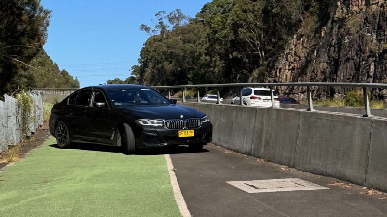 NSW Police hidden on a pedestrian and cycleway on Alford's Point Bridge in the Sutherland Shire. Photo: David McCowen