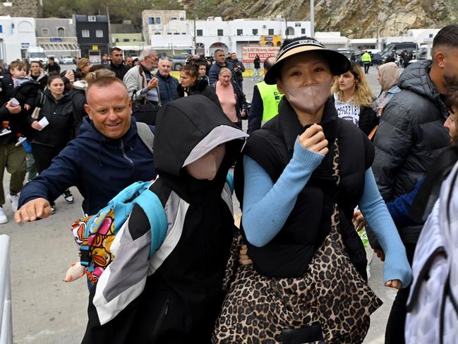 Passengers begin to board a ferry to the Athens port of Piraeus in Santorini Island, Greece. Picture: Getty Images