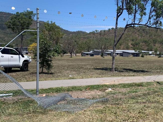 A woman has been hospitalised after her vehicle crashed through the fence at Lavarack Barracks following a three-car collision on University Road, Murray. Photo: Jami Roberts.