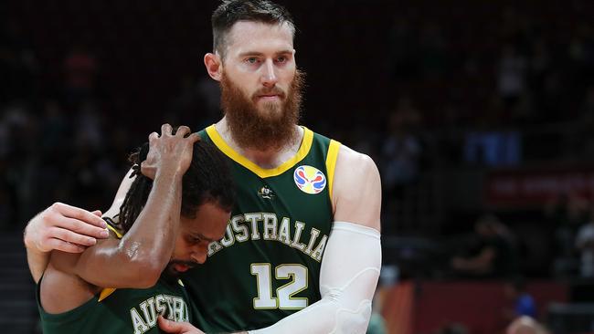 BEIJING, CHINA – SEPTEMBER 13: Aron Baynes with Patty Mills of Australia reacts after lose the game against Spain during the semi-finals of 2019 FIBA World Cup match between Spain and Australia at Beijing Wukesong Sport Arena on September 13, 2019 in Beijing, China. (Photo by Lintao Zhang/Getty Images)