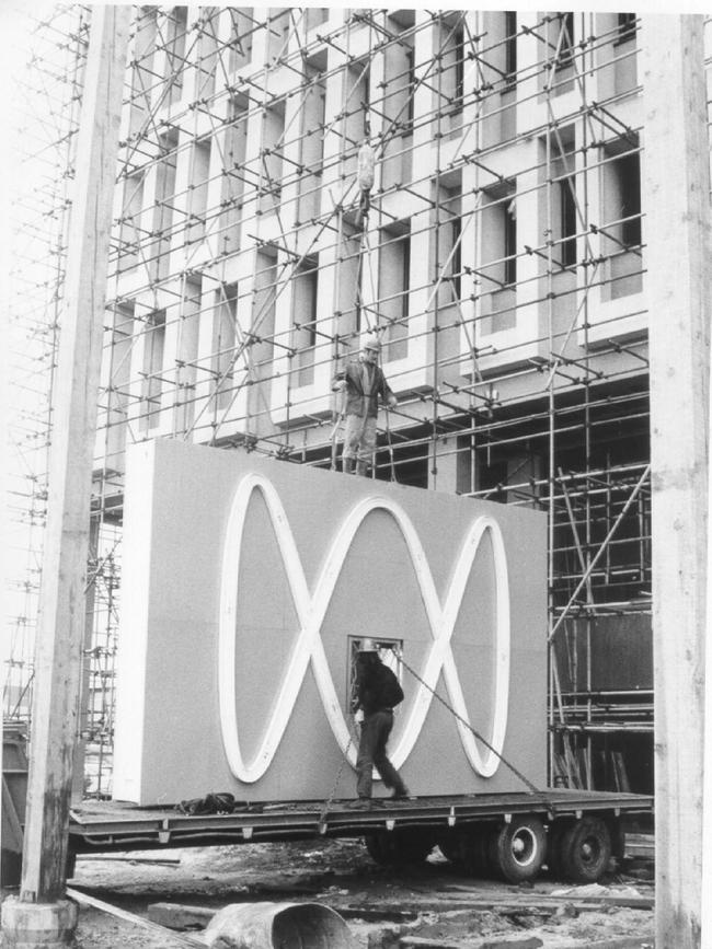 Australian Broadcasting Corporation ABC sign being lifted to top of building at Collinswood 1972.