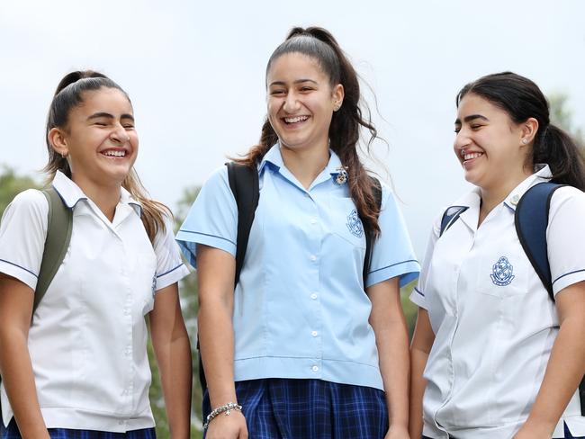 From left Reannah Hamdan, 11, with her sisters Abby Hamdan, 17, and Janah Hamdan, 14, who live in Granville but all go to Macarthur Girls High School in Parramatta. Hundreds of kids apply to go to out of area public schools and significant amounts of them get rejected. Picture: Jonathan Ng