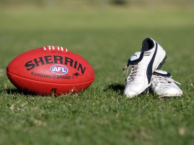 Generic AFL Sherrin football and football boots. sport /