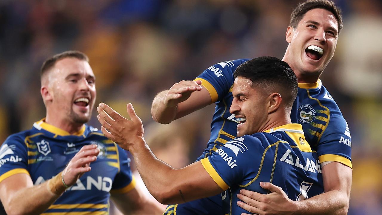 SYDNEY, AUSTRALIA - APRIL 03: Dylan Brown of the Eels celebrates with Clinton Gutherson and Mitchell Moses of the Eels after scoring a try during the round four NRL match between the Parramatta Eels and the St George Illawarra Dragons at CommBank Stadium, on April 03, 2022, in Sydney, Australia. (Photo by Mark Kolbe/Getty Images)