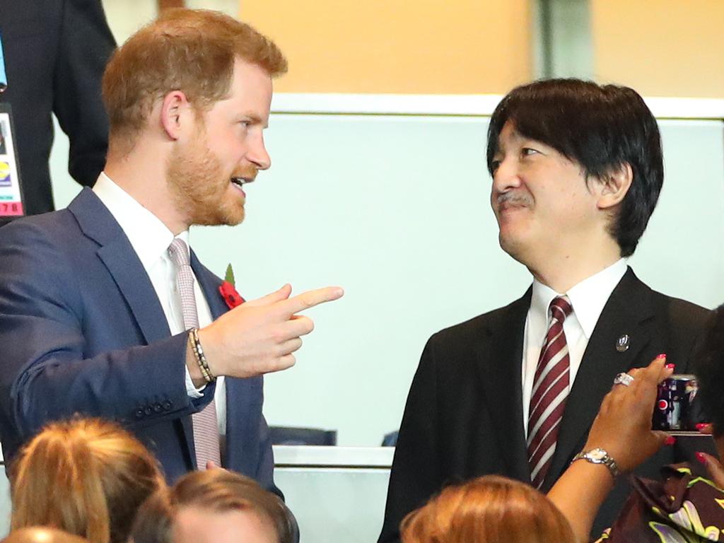 Prince Harry speaks to Fumihito, Crown Prince Akishino, in the stands during the Rugby World Cup 2019 Final. Picture: Getty