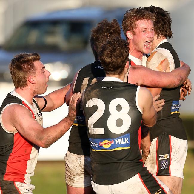 Koroit teammates congratulate Clem Nagorcka on his match-winning goal against Terang-Mortlake. Picture Yuri Kouzmin