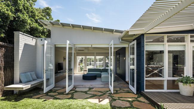 The home’s new living room opens right up to the outdoors. Pictures: Michael Kai