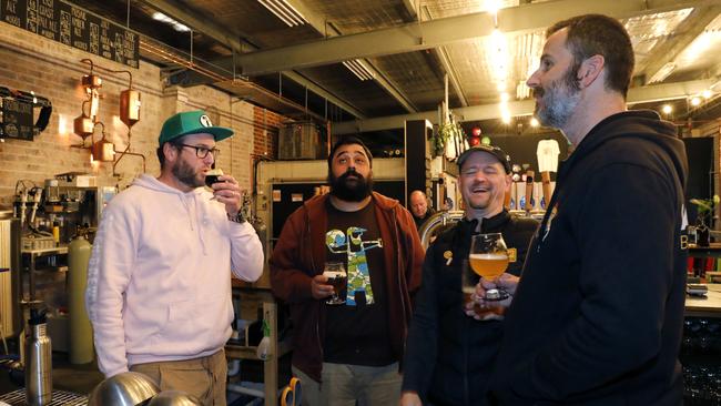 Mates: Mike Clarke with Andrew Fineran, co-owner of Batch, Liam Pereira, barman at Batch and Pete Philip at Batch Brewery in Marrickville.