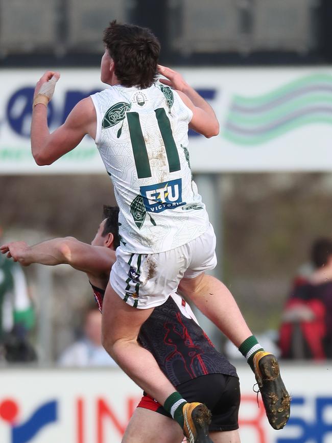 Echuca’s Cooper Barber takes a ride on a Kyabram opponent.