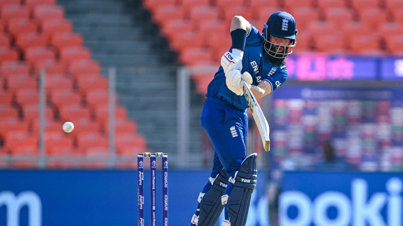 England's Moeen Ali plays a shot during the 2023 ICC men's cricket World Cup one-day international (ODI) match between England and New Zealand at the Narendra Modi Stadium in Ahmedabad on October 5, 2023. (Photo by Sajjad HUSSAIN / AFP)