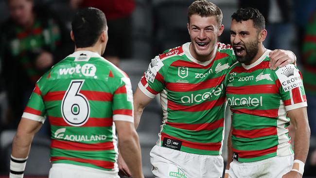 Alex Johnston, right, celebrates his long-range try in Souths’ win over Canterbury. Picture: Getty Images