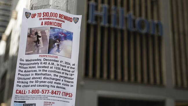 A reward poster hangs outside the New York Hilton in Midtown Manhattan where Brian Thompson, the CEO of UnitedHealthcare, was fatally shot. Picture: AP