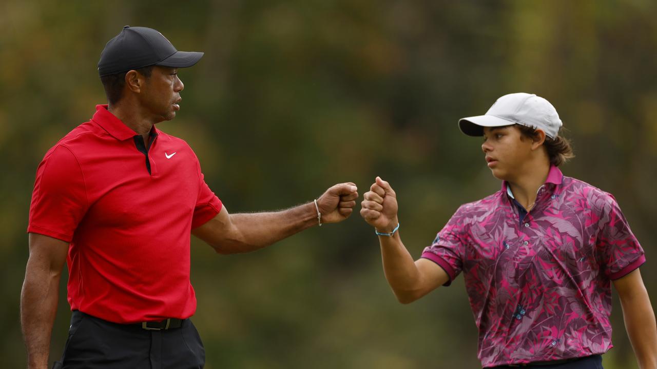 Tiger Woods of the United States and son, Charlie Woods, react on the 15th green during the final round of the PNC Championship at The Ritz-Carlton Golf Club on December 17, 2023 in Orlando, Florida. (Photo by Mike Ehrmann/Getty Images)