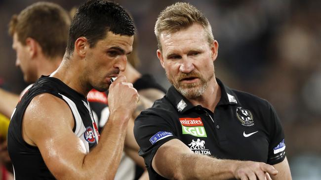 Senior coach Nathan Buckley of the Magpies speaks with Scott Pendlebury suring one of his last games as coach in 2021. Picture: Dylan Burns