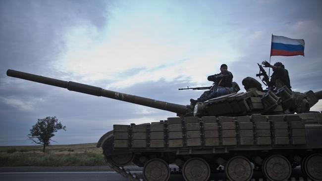 APCs and four tanks carrying Russian flags seen on the road from Donetsk to the Russian border. Picture: Ella Pellegrini