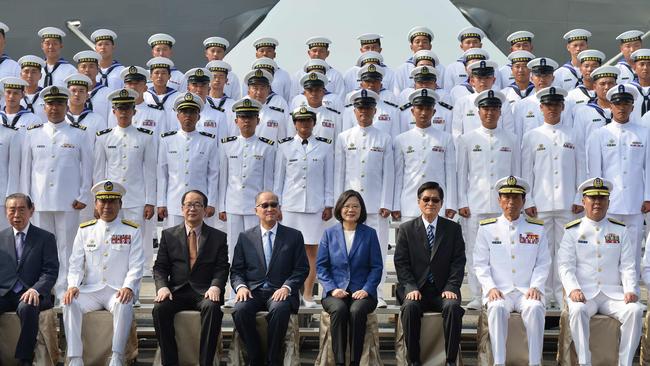 Taiwan's President Tsai Ing-Wen, centre, in blue jacket, and assembled naval personnel take part in a ceremony to commission two Perry-class guided missile frigates from the US into the Taiwan Navy, in 2018. Picture: AGP