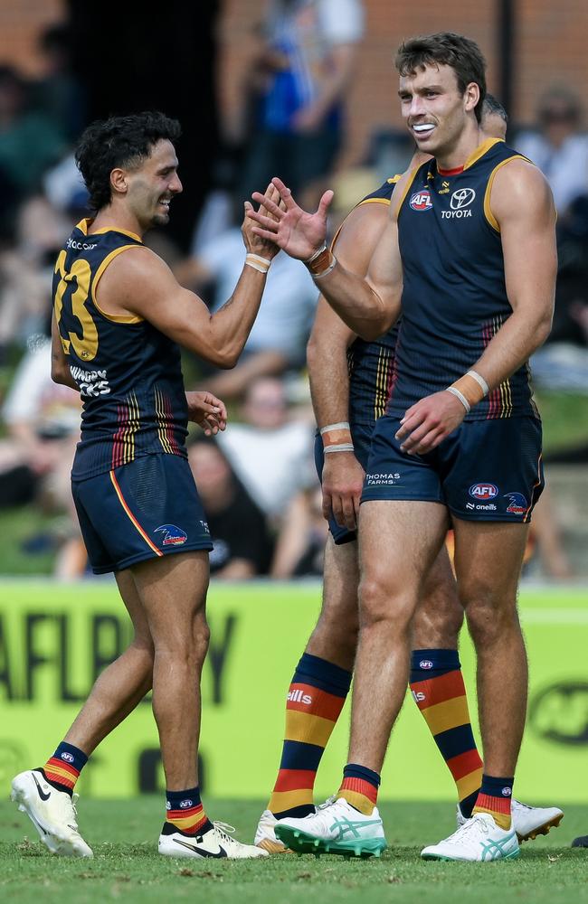 Izak Rankine celebrates a goal with Riley Thilthorpe during a pre-season game. Thilthorpe isn’t far off. Picture: Mark Brake/Getty Images.
