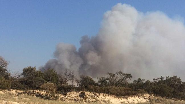 A critical hour is upon firefighting crews working to contain a major bushfire in the Sunshine Coast's north. Picture: john mccutcheon