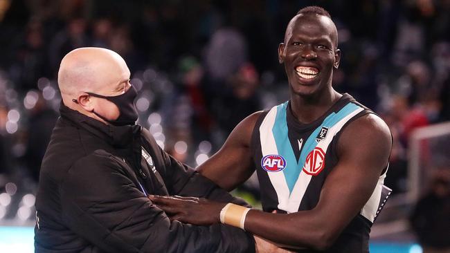 Port Adelaide football manager Chris Davies and Aliir Aliir after the qualifying final win. Picture: Sarah Reed/AFL Photos