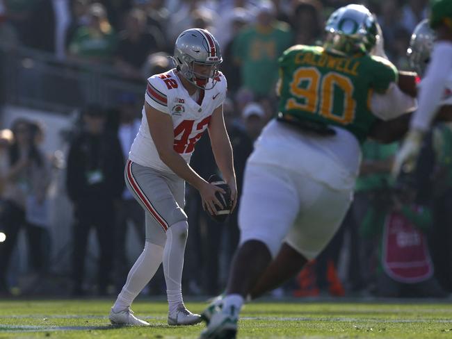 Joe McGuire punts the ball during the first quarter against the Oregon Ducks during the Rose Bowl. Picture: Getty Images